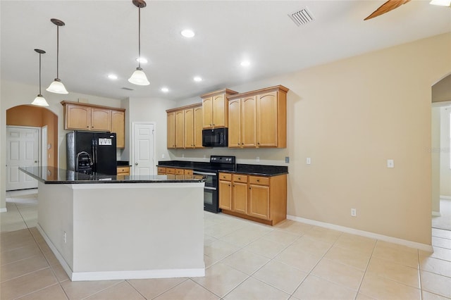 11716 Summer Springs Dr, Riverview, FL 33579 - kitchen featuring arched walkways, black appliances, recessed lighting, light tile patterned flooring, and baseboards