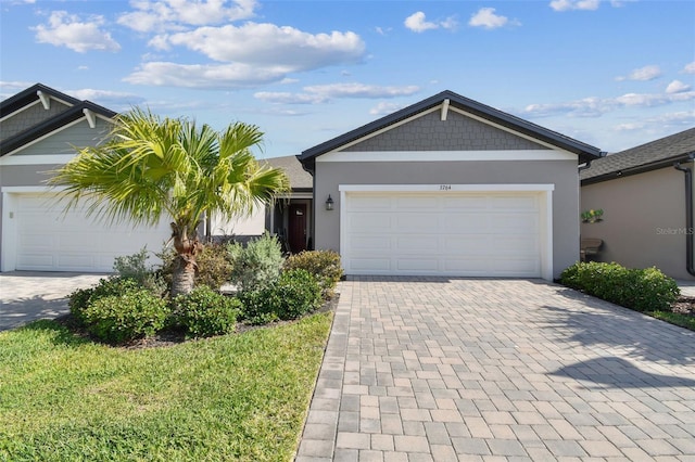 ranch-style home with stucco siding, decorative driveway, and an attached garage