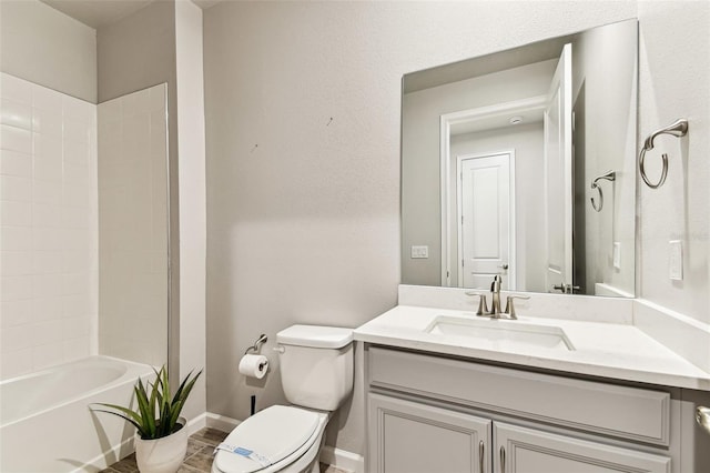 bathroom featuring toilet, bathtub / shower combination, vanity, and baseboards