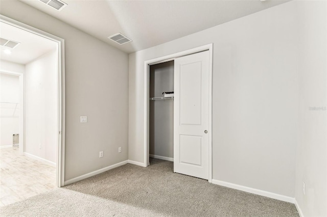 unfurnished bedroom featuring visible vents, a closet, and baseboards