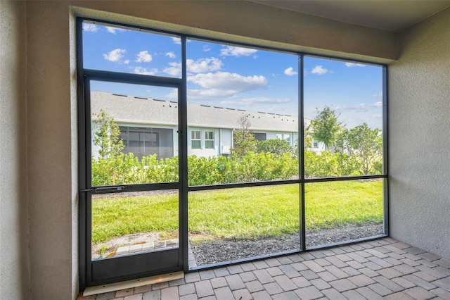 unfurnished sunroom featuring a wealth of natural light