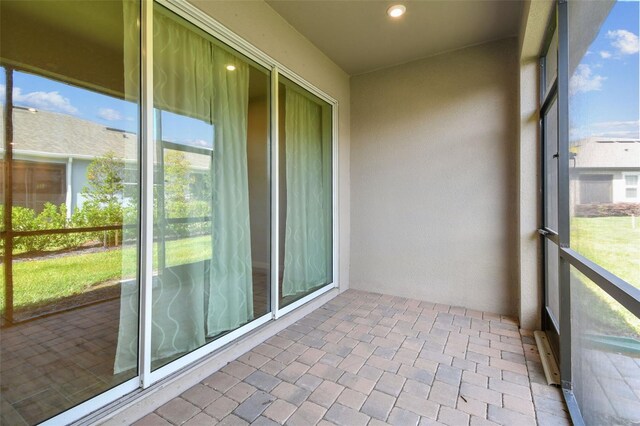 unfurnished sunroom with recessed lighting