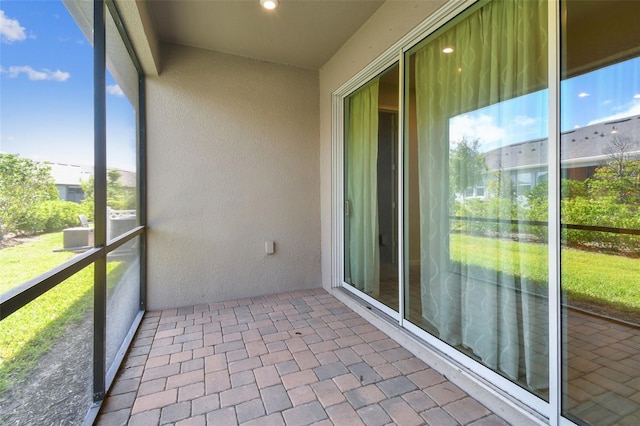 unfurnished sunroom featuring a wealth of natural light