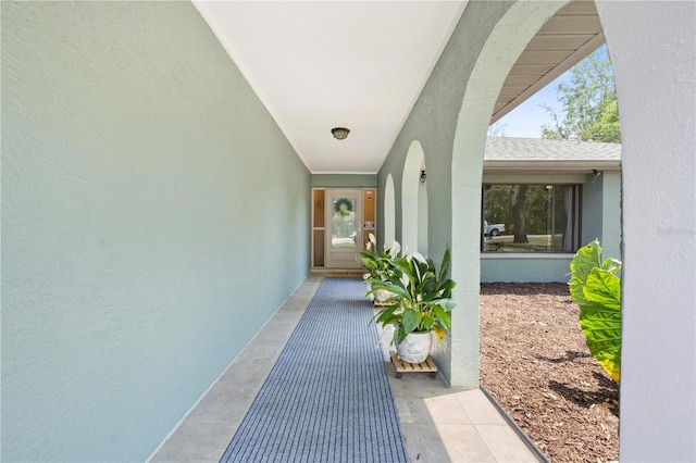 view of exterior entry with stucco siding