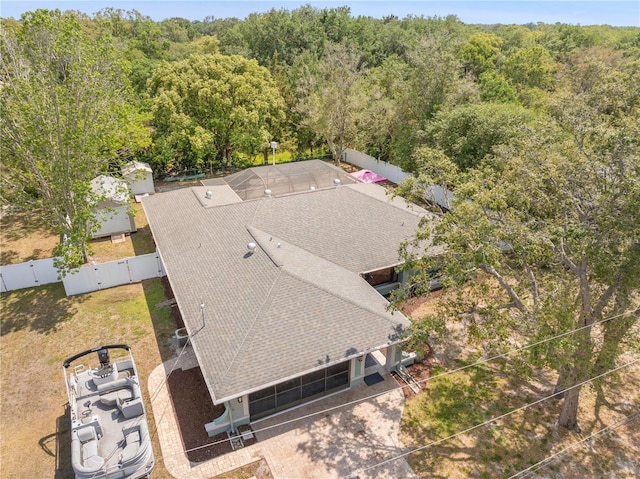 birds eye view of property with a wooded view