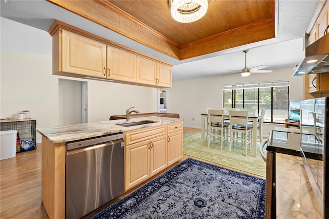 kitchen with light brown cabinets, stainless steel dishwasher, a ceiling fan, a sink, and a raised ceiling