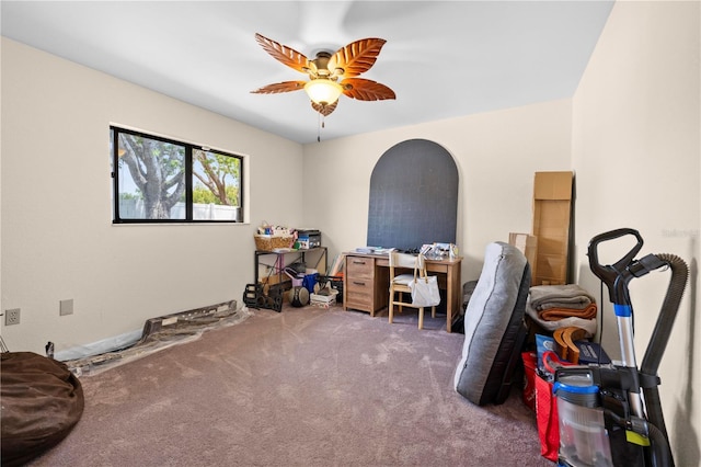 home office with a ceiling fan and carpet floors