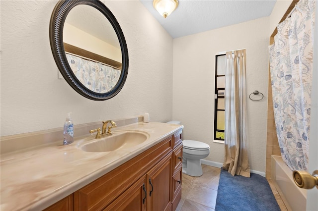 full bath featuring a textured wall, toilet, and vanity