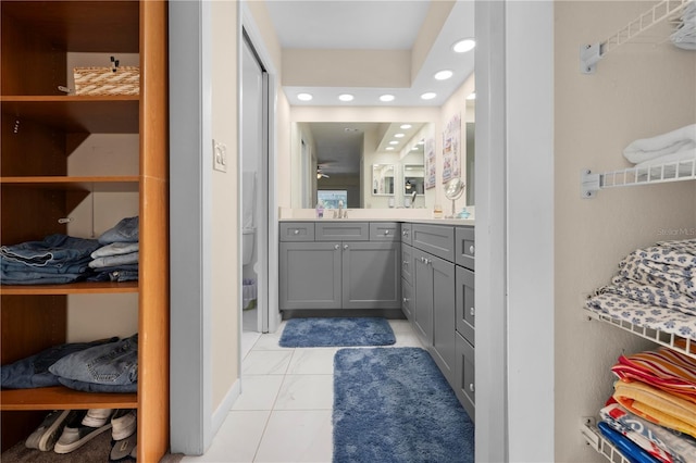 bathroom featuring tile patterned flooring, vanity, recessed lighting, and toilet