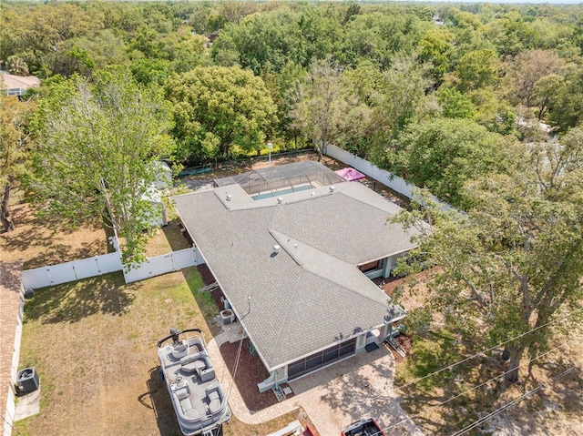 birds eye view of property with a forest view