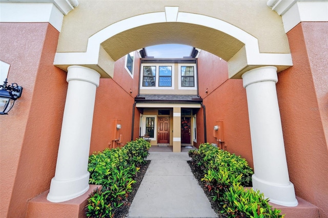 property entrance featuring stucco siding