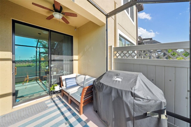 view of patio with fence, ceiling fan, and a grill