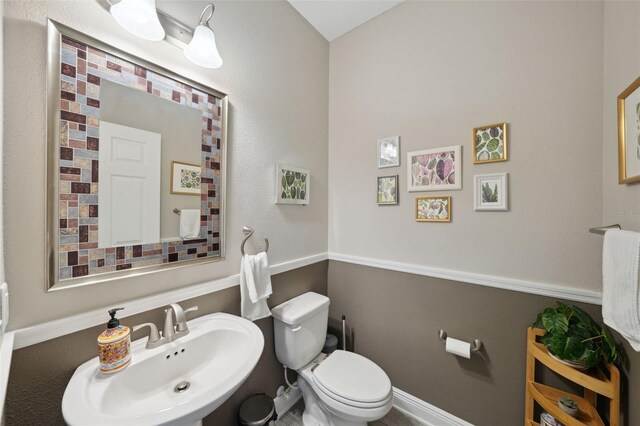 bathroom with a sink and toilet