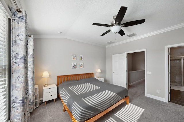 bedroom featuring visible vents, crown molding, vaulted ceiling, baseboards, and carpet flooring