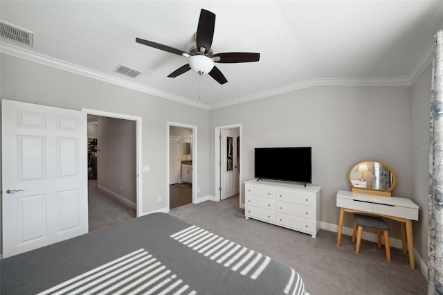 carpeted bedroom with visible vents, ornamental molding, and baseboards