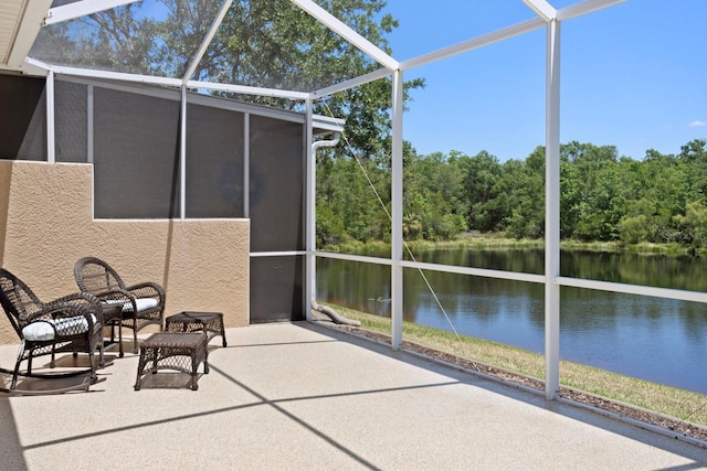 unfurnished sunroom with a water view