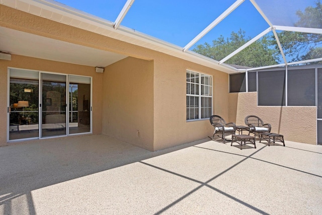 view of patio / terrace featuring a lanai