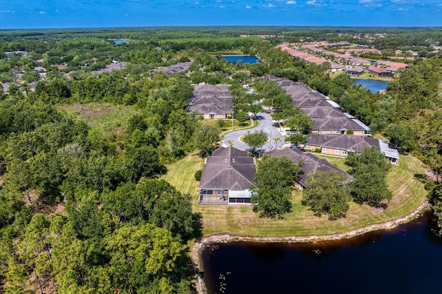 bird's eye view featuring a residential view and a water view
