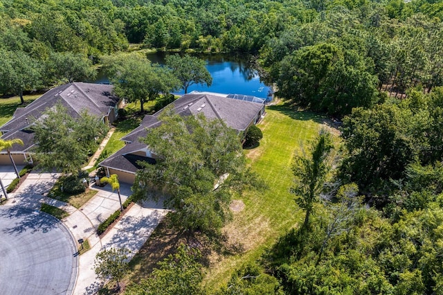 aerial view featuring a forest view and a water view