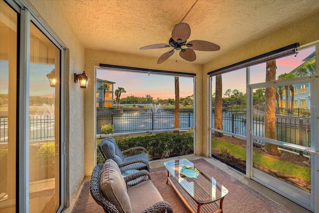 600 Gardens Edge Dr Unit 614, Venice, FL 34285 - sunroom with a water view, ceiling fan, and plenty of natural light