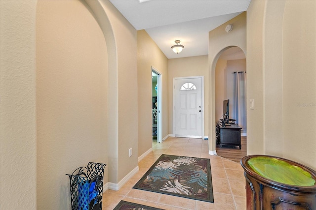 600 Gardens Edge Dr Unit 614, Venice, FL 34285 - tiled foyer featuring arched walkways and baseboards