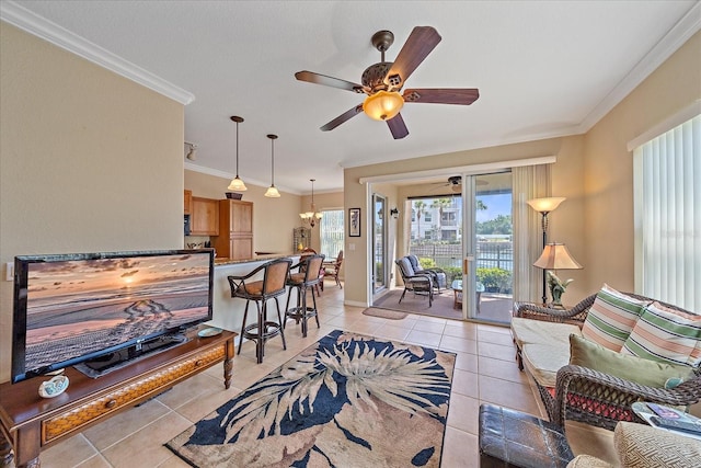 600 Gardens Edge Dr Unit 614, Venice, FL 34285 - living area with light tile patterned flooring, ornamental molding, a ceiling fan, a chandelier, and baseboards