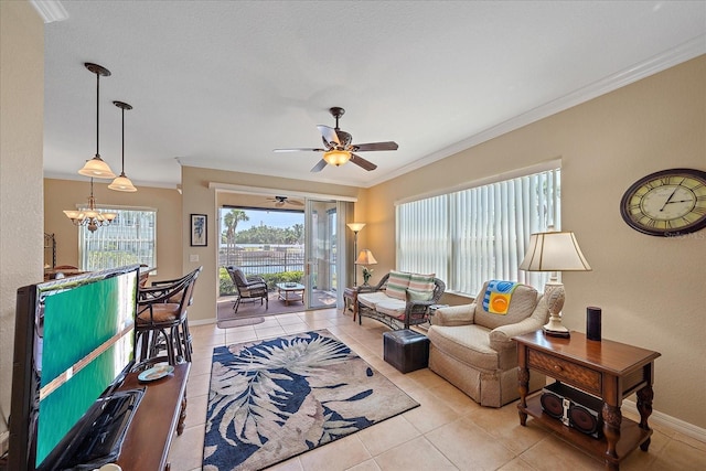 600 Gardens Edge Dr Unit 614, Venice, FL 34285 - living area featuring crown molding, a chandelier, light tile patterned floors, ceiling fan, and baseboards