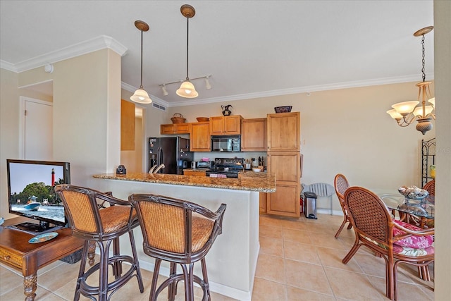 600 Gardens Edge Dr Unit 614, Venice, FL 34285 - kitchen featuring black appliances, crown molding, light tile patterned floors, stone counters, and brown cabinets