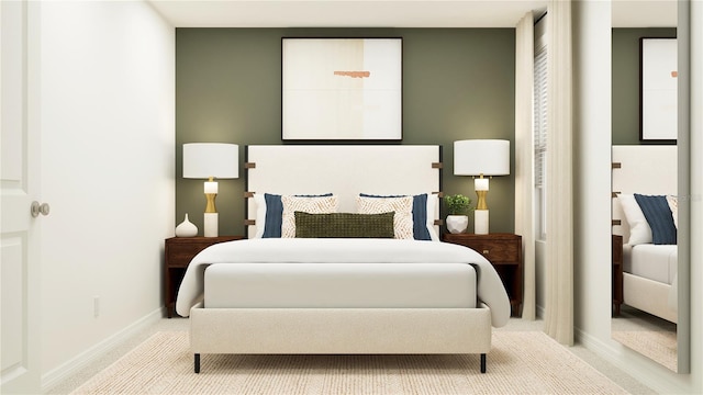 bedroom featuring baseboards and carpet