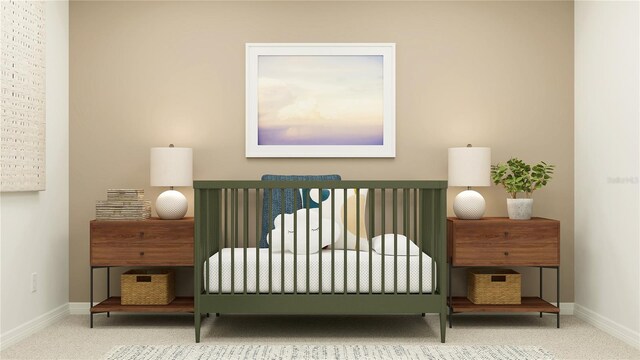 bedroom featuring baseboards and carpet flooring
