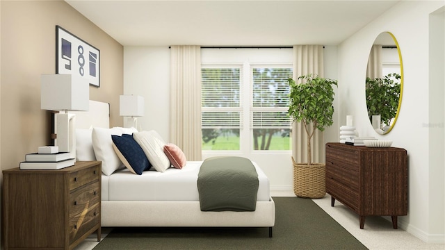bedroom featuring baseboards and light colored carpet