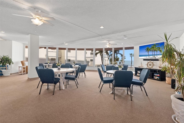 dining room with a ceiling fan, carpet flooring, a textured ceiling, and recessed lighting