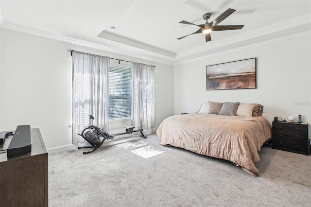 3952 Bonfire Dr, Odessa, FL 33556 - carpeted bedroom featuring baseboards, a tray ceiling, crown molding, and a ceiling fan