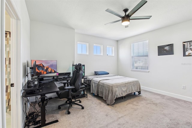 3952 Bonfire Dr, Odessa, FL 33556 - bedroom with baseboards, ceiling fan, and carpet