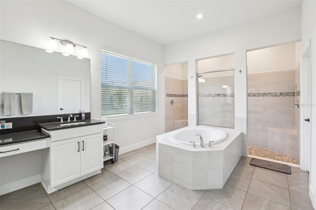 3952 Bonfire Dr, Odessa, FL 33556 - full bath with tile patterned flooring, vanity, a bath, and a walk in shower
