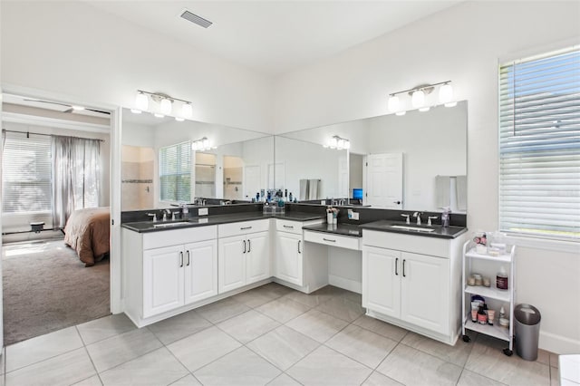 3952 Bonfire Dr, Odessa, FL 33556 - ensuite bathroom featuring tile patterned flooring, plenty of natural light, and vanity
