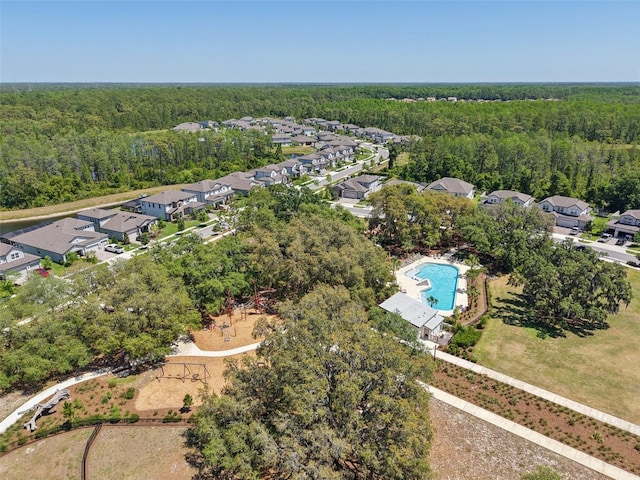 3952 Bonfire Dr, Odessa, FL 33556 - birds eye view of property featuring a view of trees and a residential view