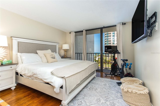 1581 Gulf Blvd Unit 301N, Clearwater Beach, FL 33767 - bedroom featuring wood finished floors and access to exterior