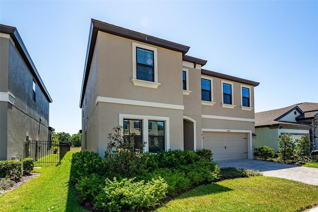 14623 Horse Trot Rd, Lithia, FL 33547 - view of front facade with stucco siding, a garage, and decorative driveway