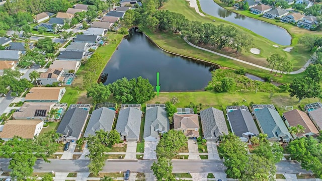 aerial view featuring a water view, a residential view, and golf course view