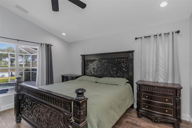 bedroom with recessed lighting, ceiling fan, wood finished floors, and lofted ceiling