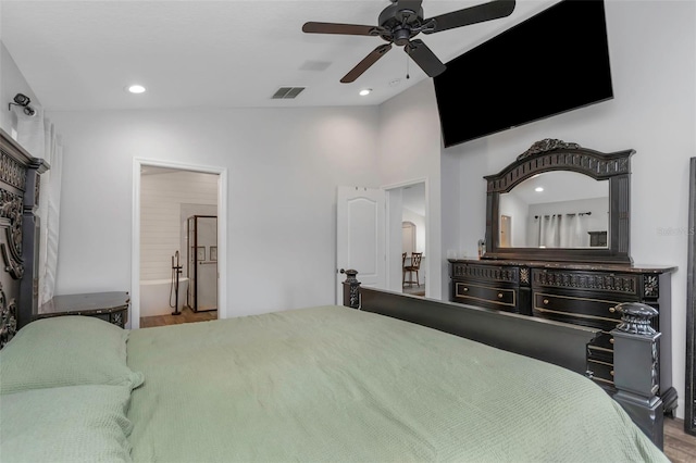 bedroom with visible vents, lofted ceiling, wood finished floors, recessed lighting, and a ceiling fan