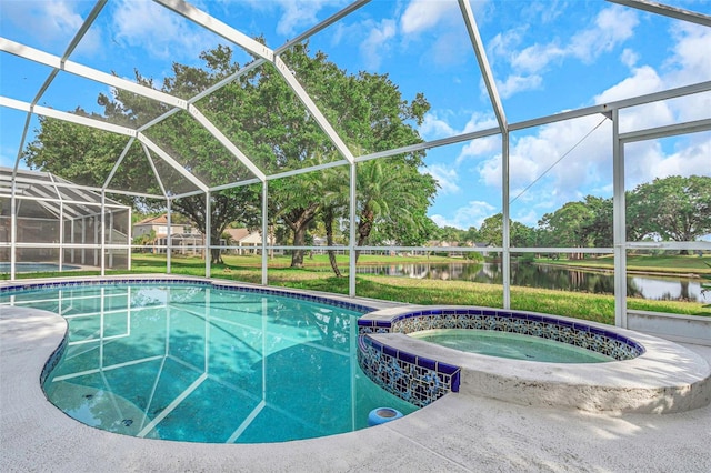 view of pool featuring glass enclosure, a water view, and a pool with connected hot tub