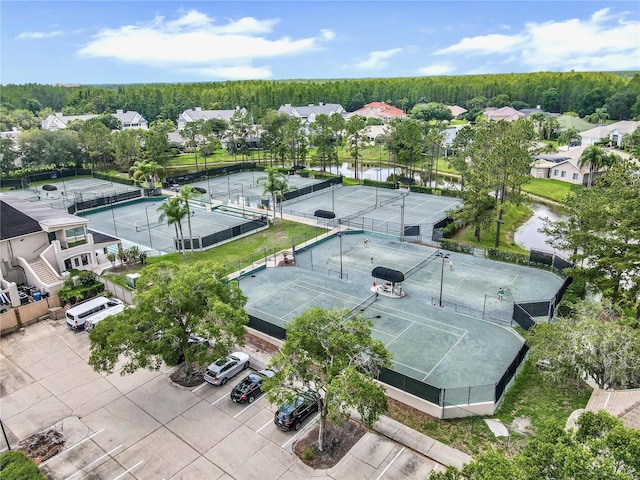 drone / aerial view with a water view and a residential view