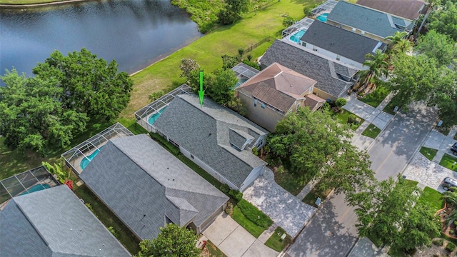 birds eye view of property featuring a water view and a residential view