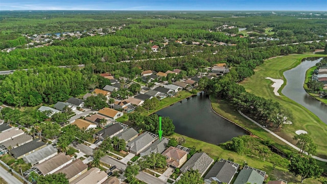 drone / aerial view with a forest view, a residential view, a water view, and golf course view
