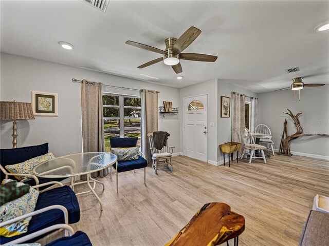 131 Oak Park Ave, Brooksville, FL 34601 - living area with baseboards, wood finished floors, visible vents, and ceiling fan
