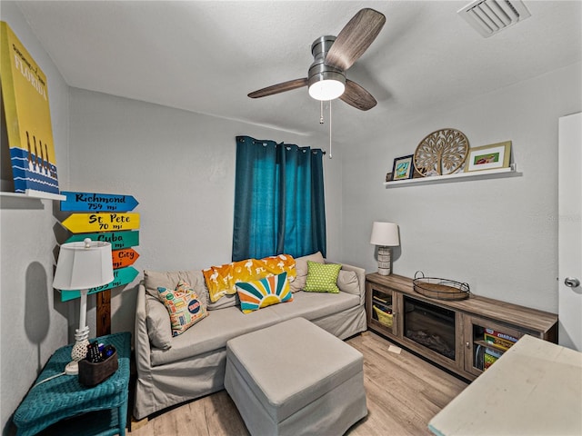131 Oak Park Ave, Brooksville, FL 34601 - living room with ceiling fan, wood finished floors, and visible vents