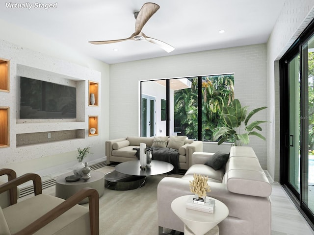living area featuring recessed lighting and a ceiling fan