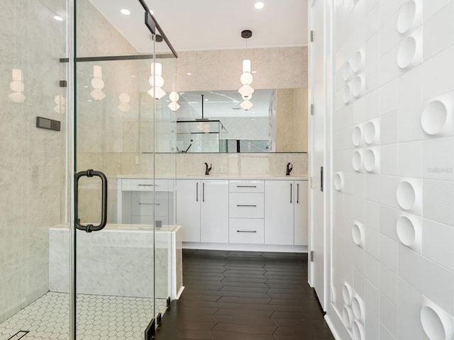 full bathroom featuring tile patterned floors, a stall shower, tile walls, recessed lighting, and vanity